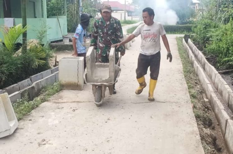 Satgas TMMD Pasang U-Ditch Drainase di Ruas 12 Guna Kurangi Genangan Air 
